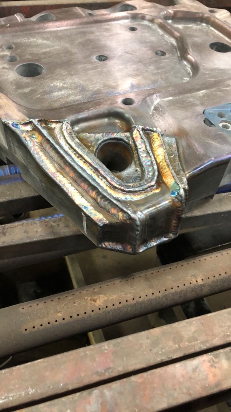Welded steel bracket with visible weld seams